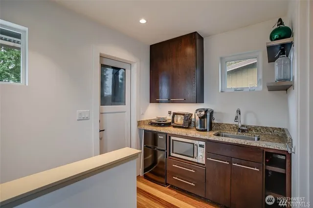 a kitchen with a sink and cabinets