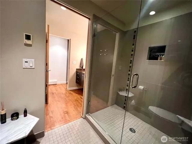 a bathroom with a tub and shower