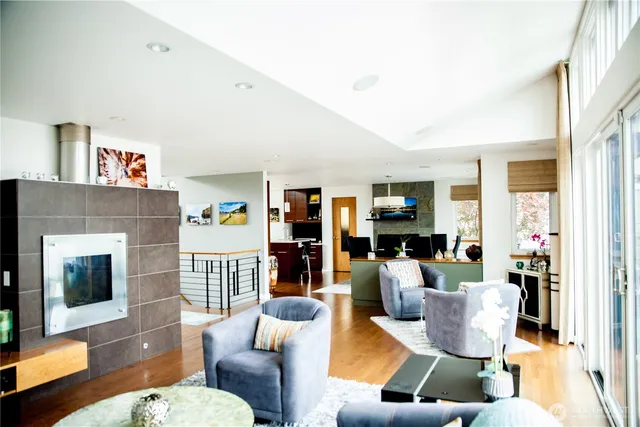 a living room with furniture fireplace and flat screen tv