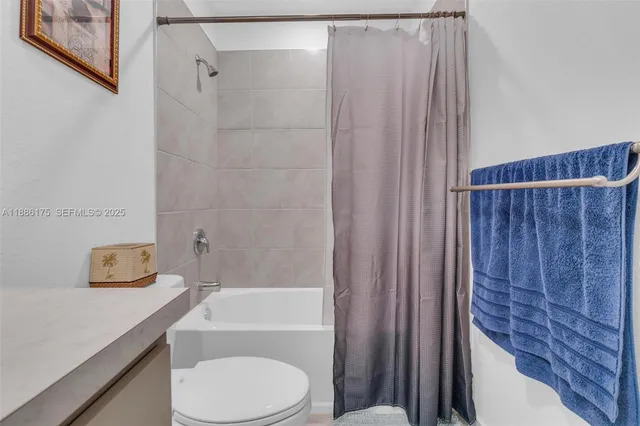 a bedroom with a bed and dresser