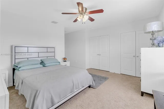 a bedroom with furniture and a window