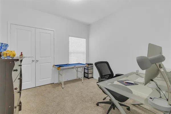 a view of a workspace with furniture
