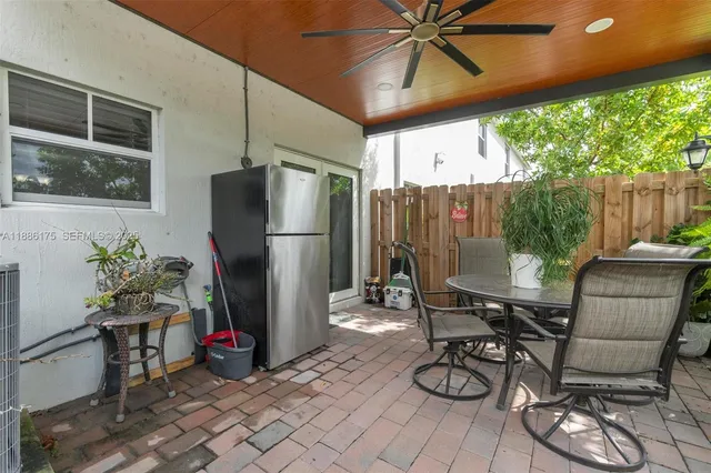 a car parked in front of white house