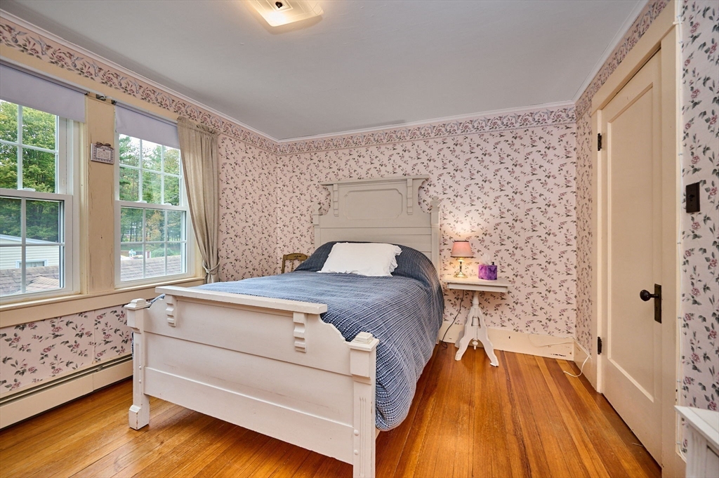 102 Elm Street Buckland, MA 01370 - Photo 17 of 35 a bed sitting in a bedroom next to a window