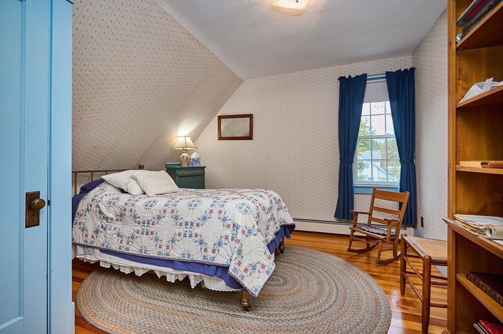 102 Elm Street Buckland, MA 01370 - Photo 19 of 35 a bedroom with a bed and a flat screen tv