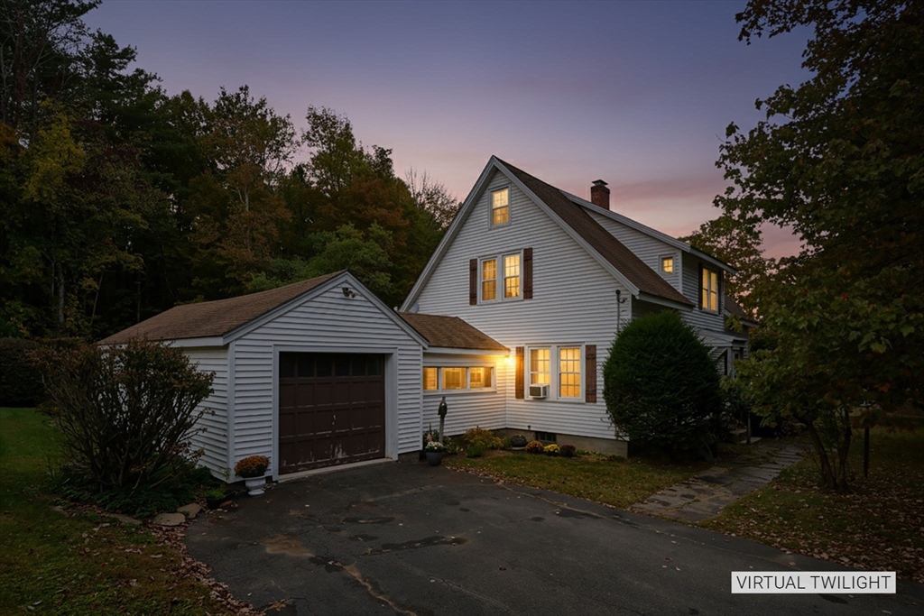 102 Elm Street Buckland, MA 01370 - Photo 30 of 35 a front view of a house with a yard and garage