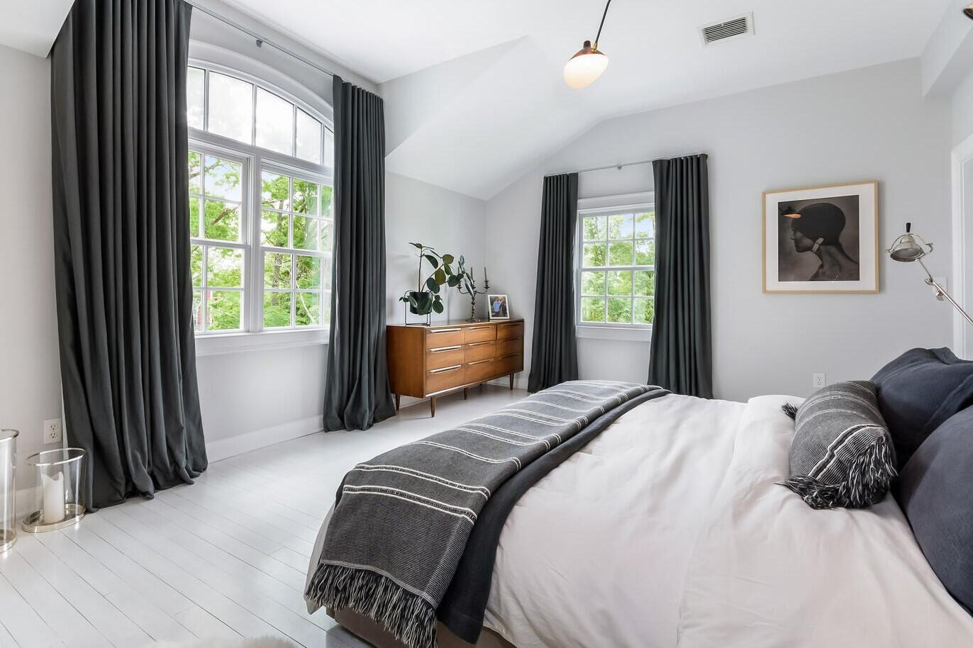 16 Mayflower Road Darien, CT 06820 - Photo 13 of 35 a bedroom with a bed and glass window