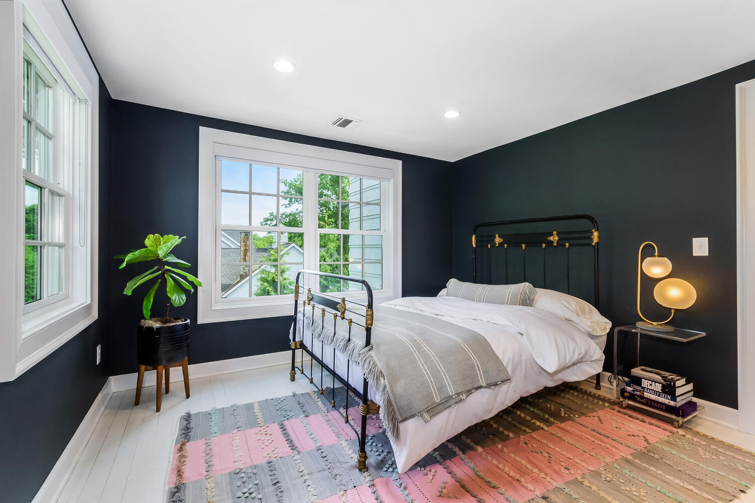 16 Mayflower Road Darien, CT 06820 - Photo 18 of 35 a bedroom with a bed lamp and a potted plant