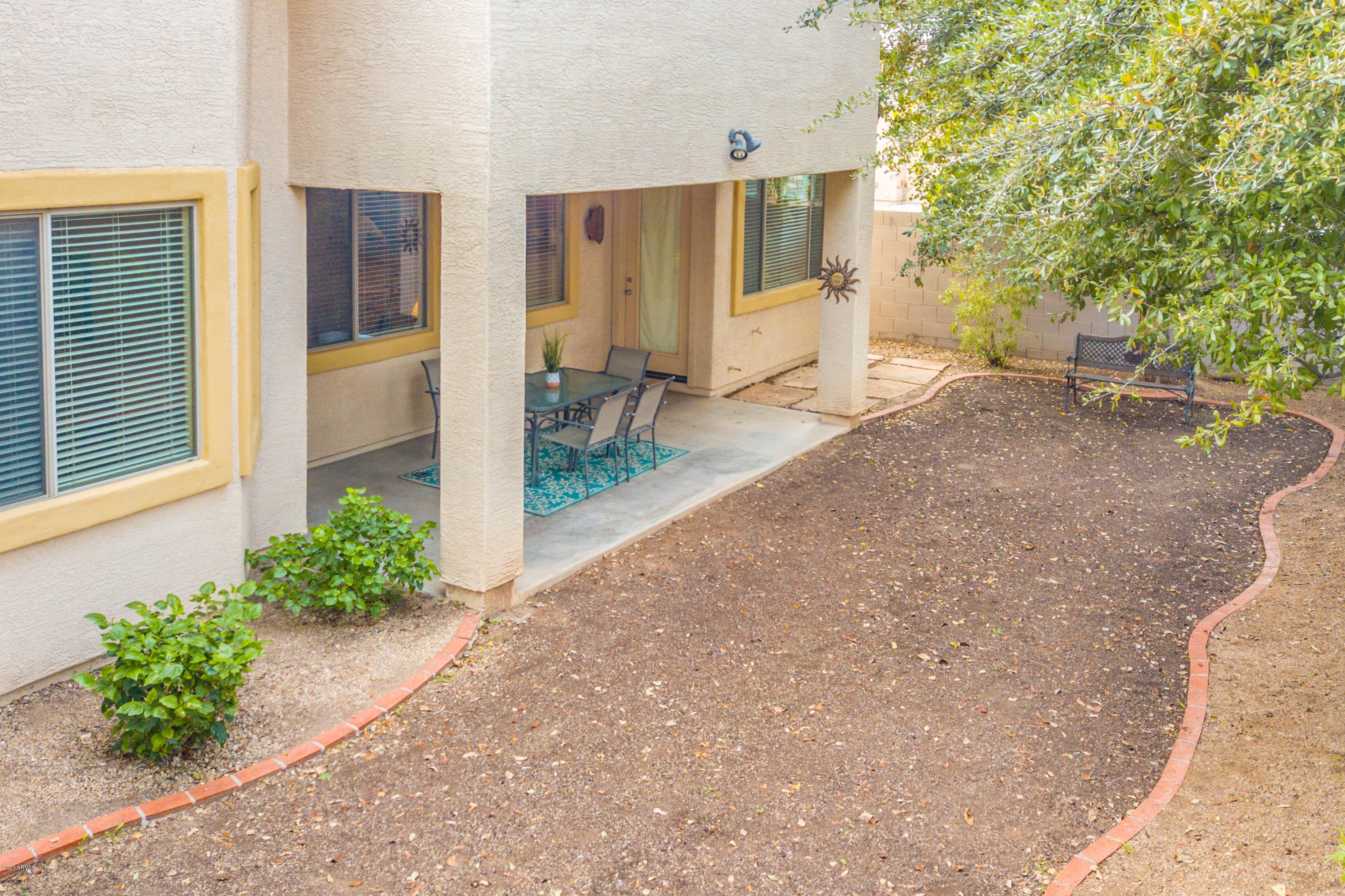2426 West Apache Rain Road Phoenix, AZ 85085 - Photo 26 of 27 a front view of a house with garden