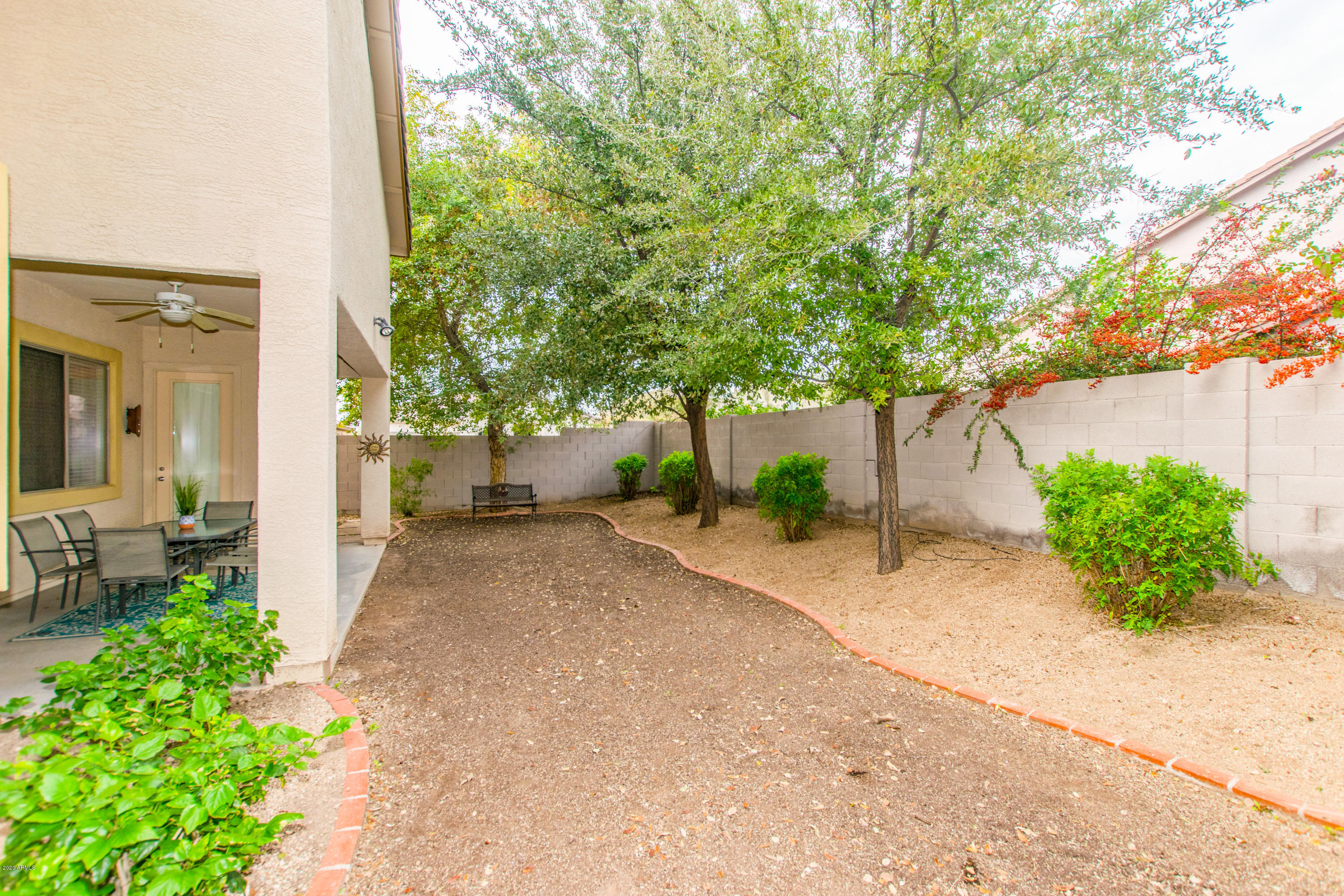 2426 West Apache Rain Road Phoenix, AZ 85085 - Photo 27 of 27 a view of a house with a backyard