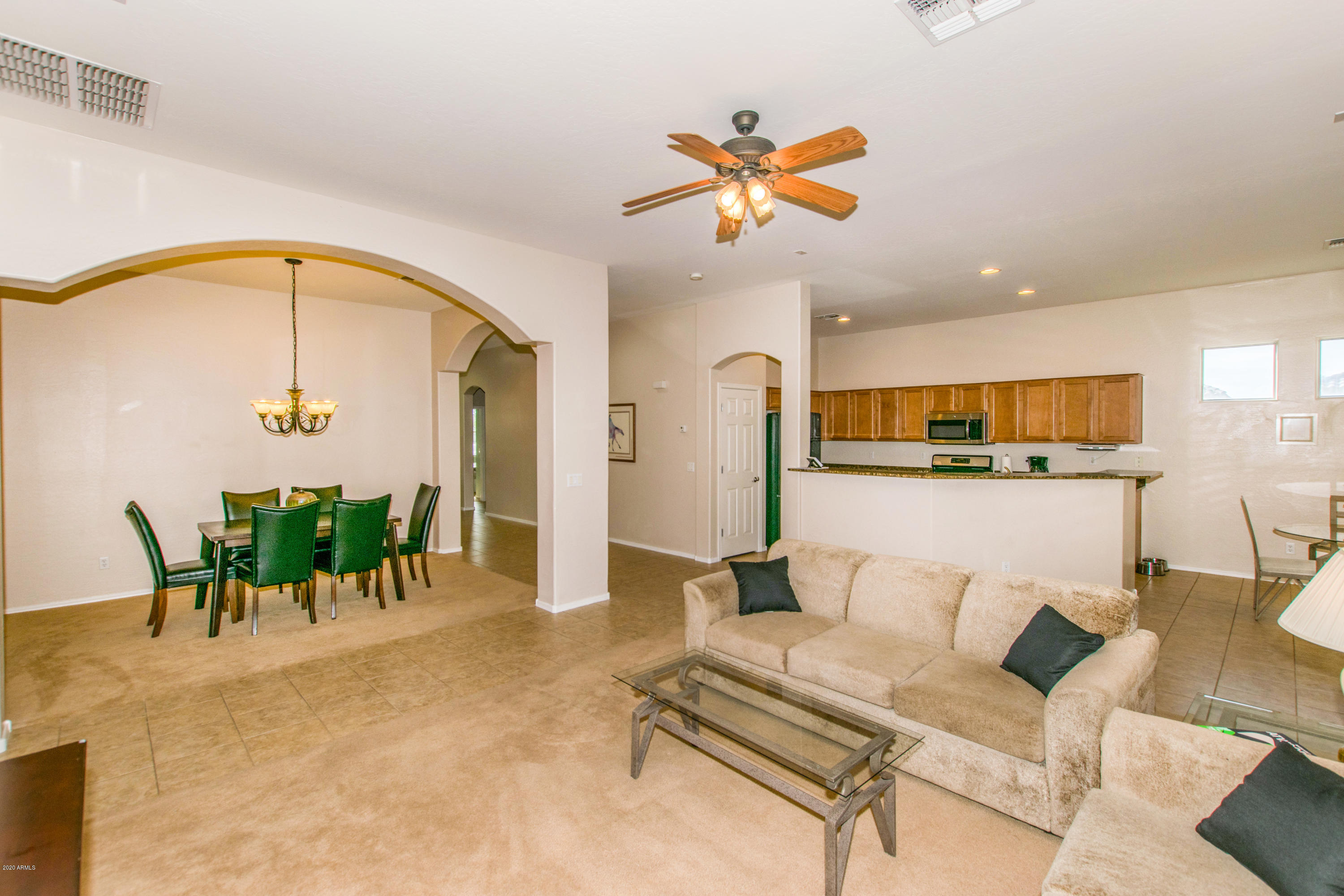2426 West Apache Rain Road Phoenix, AZ 85085 - Photo 4 of 27 a living room with furniture