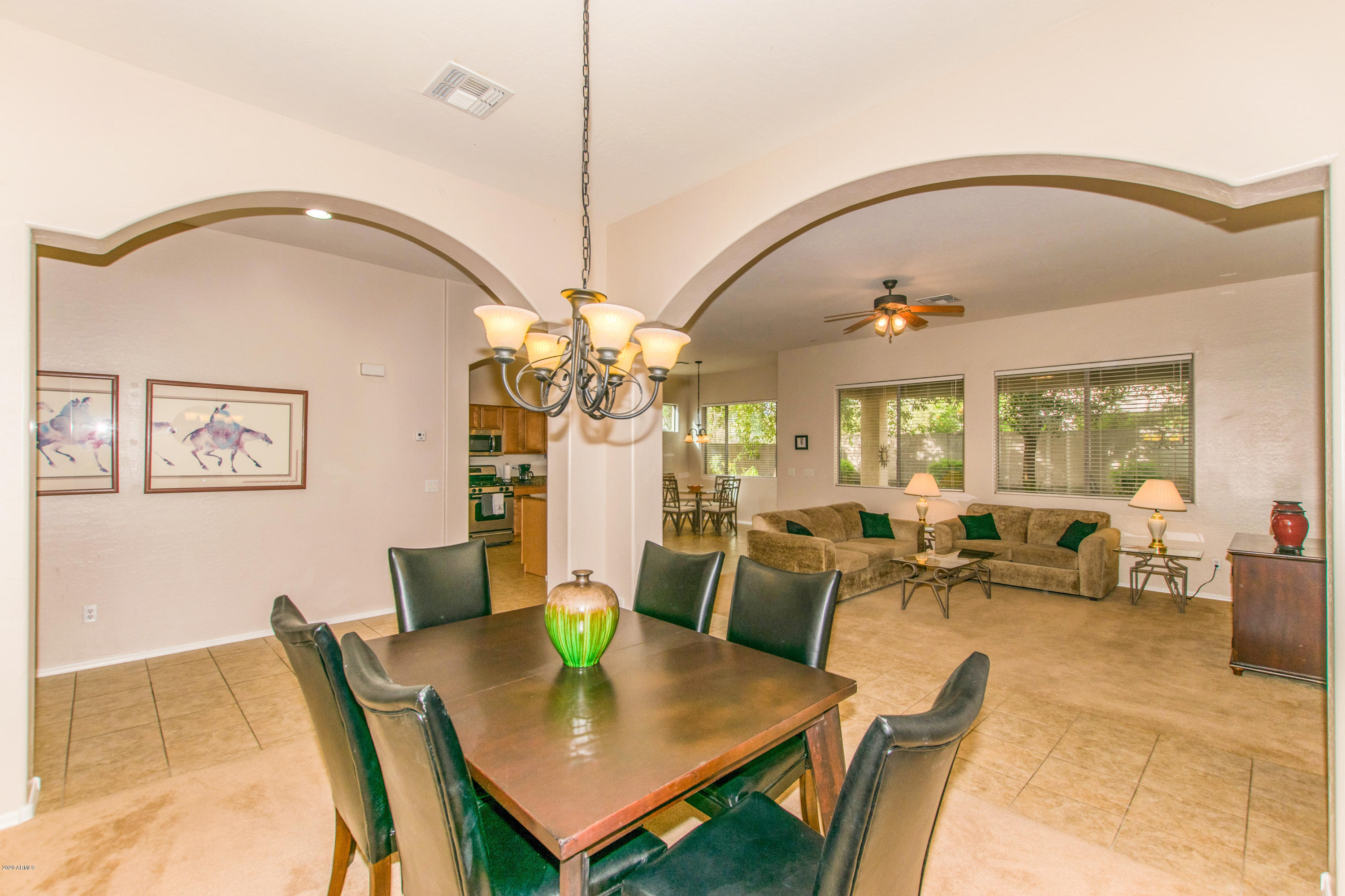 2426 West Apache Rain Road Phoenix, AZ 85085 - Photo 10 of 27 a view of a dining room with furniture
