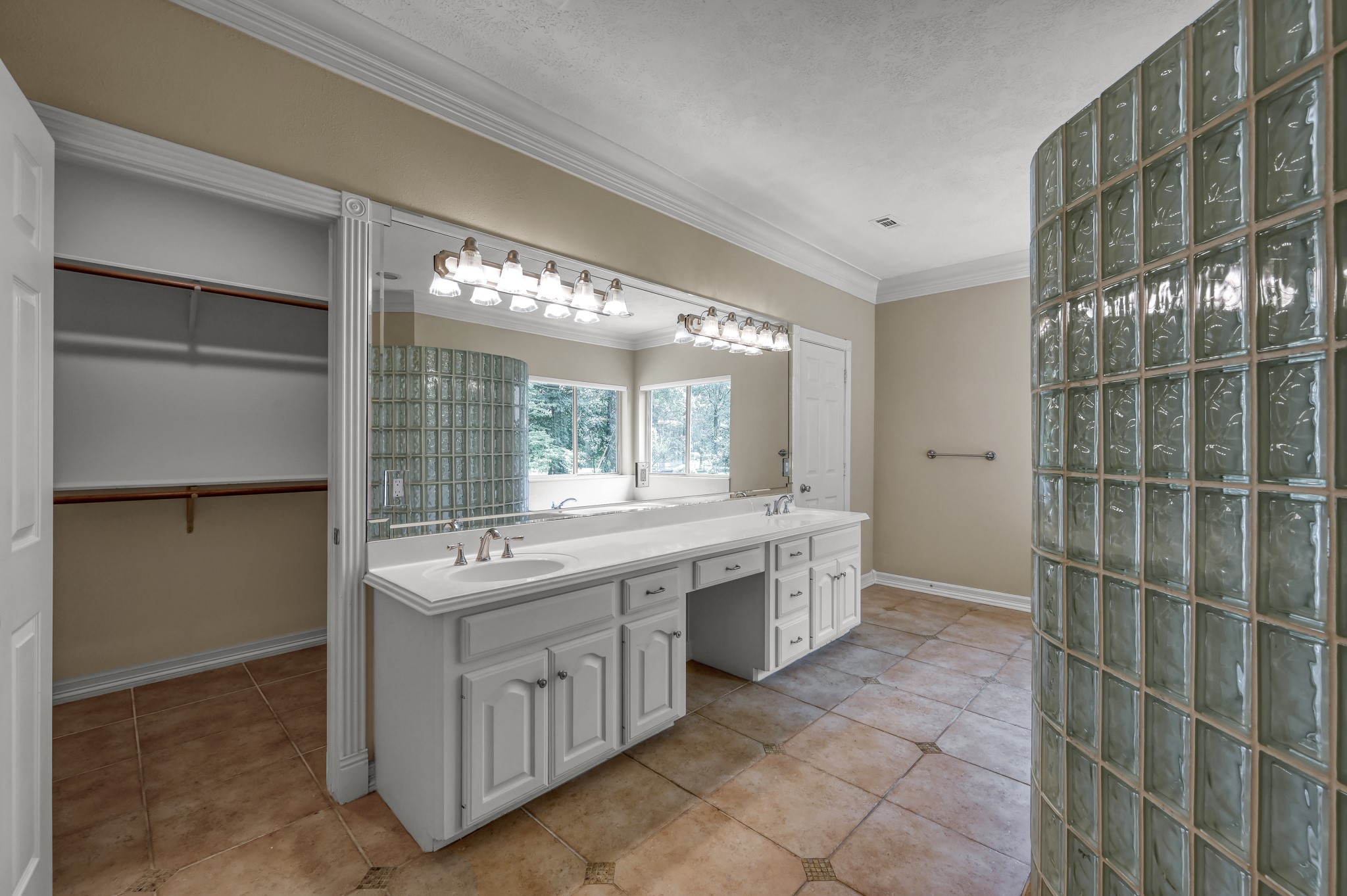 2205 Longmire Road Conroe, TX 77304 - Photo 23 of 49 Two huge walk in closets sit on either side of the vanity.