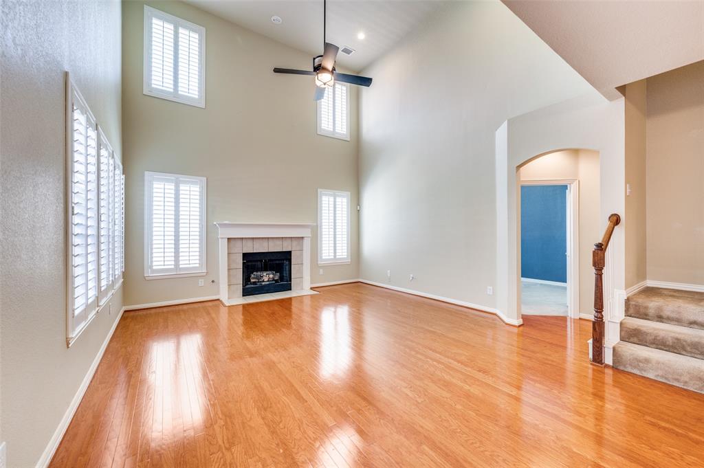 3912 Sovereign Drive Bedford, TX 76021 - Photo 1 of 1 a view of a livingroom with wooden floor and a fireplace