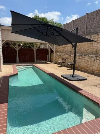 a view of a backyard with sitting area