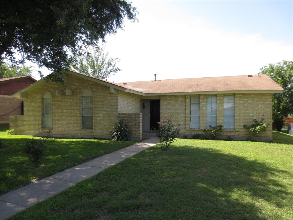 1336 Mill Stream Drive Dallas, TX 75232 - Photo 1 of 9 a front view of a house with a yard