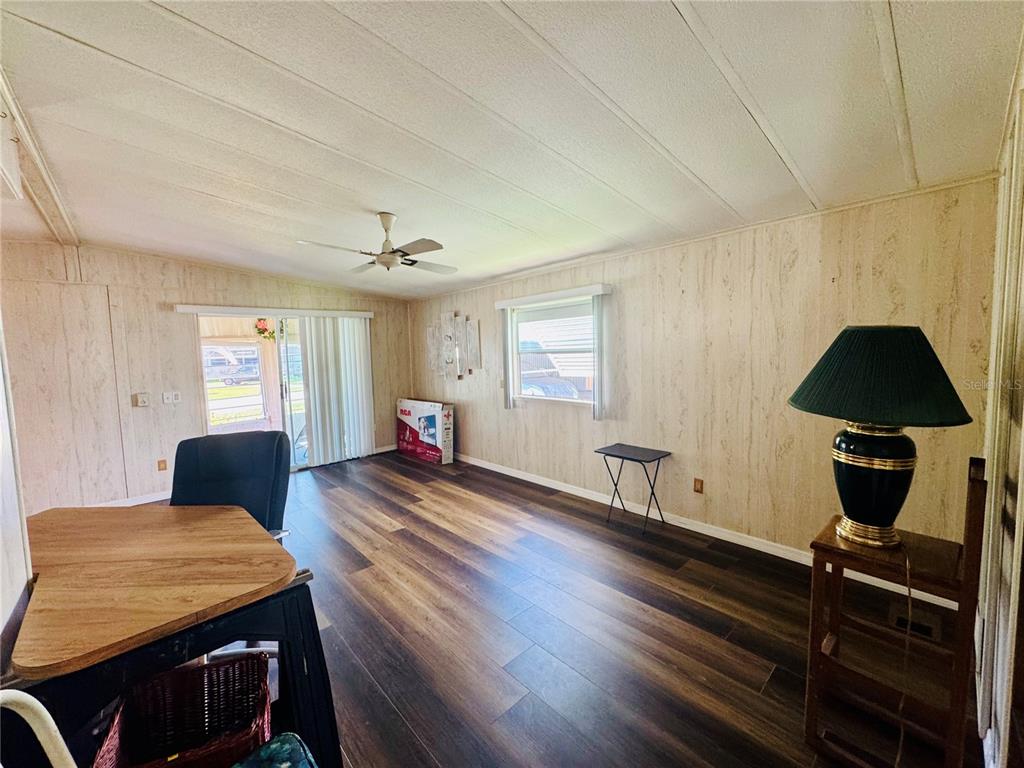 127 Ash Street Edgewater, FL 32141 - Photo 5 of 13 a living room with furniture and wooden floor