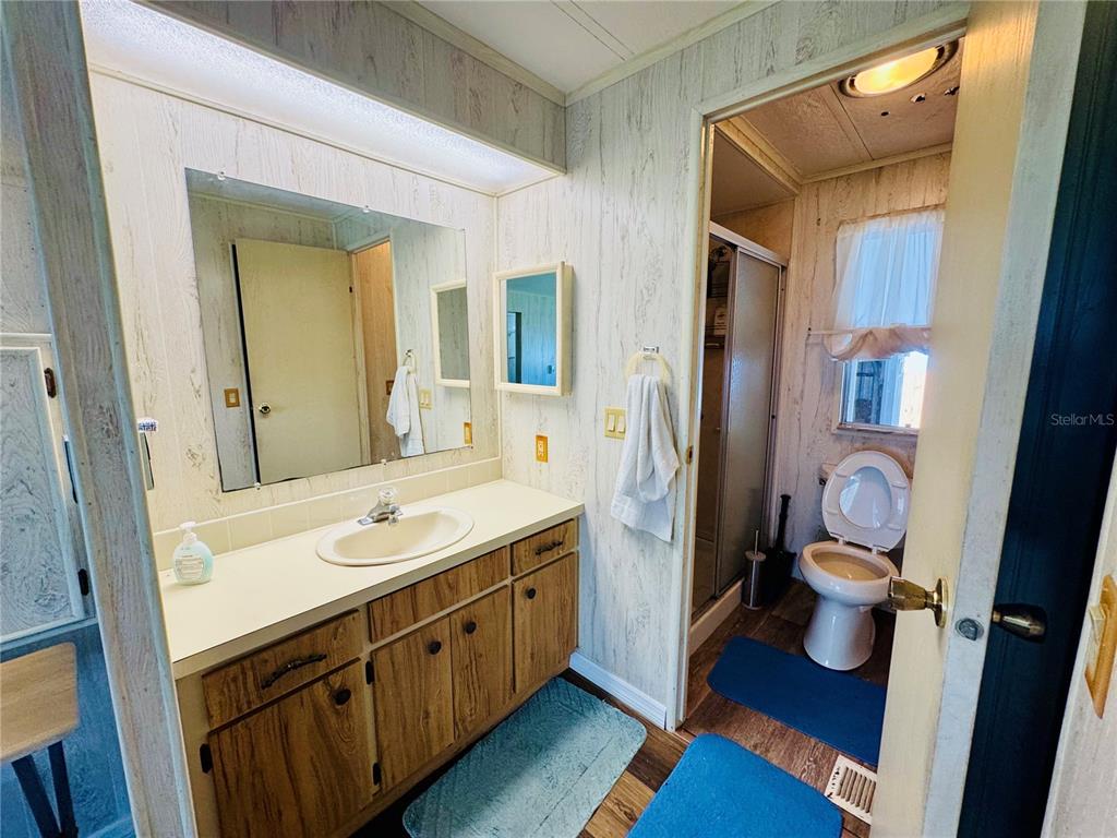 127 Ash Street Edgewater, FL 32141 - Photo 9 of 13 a bathroom with a sink a toilet and shower