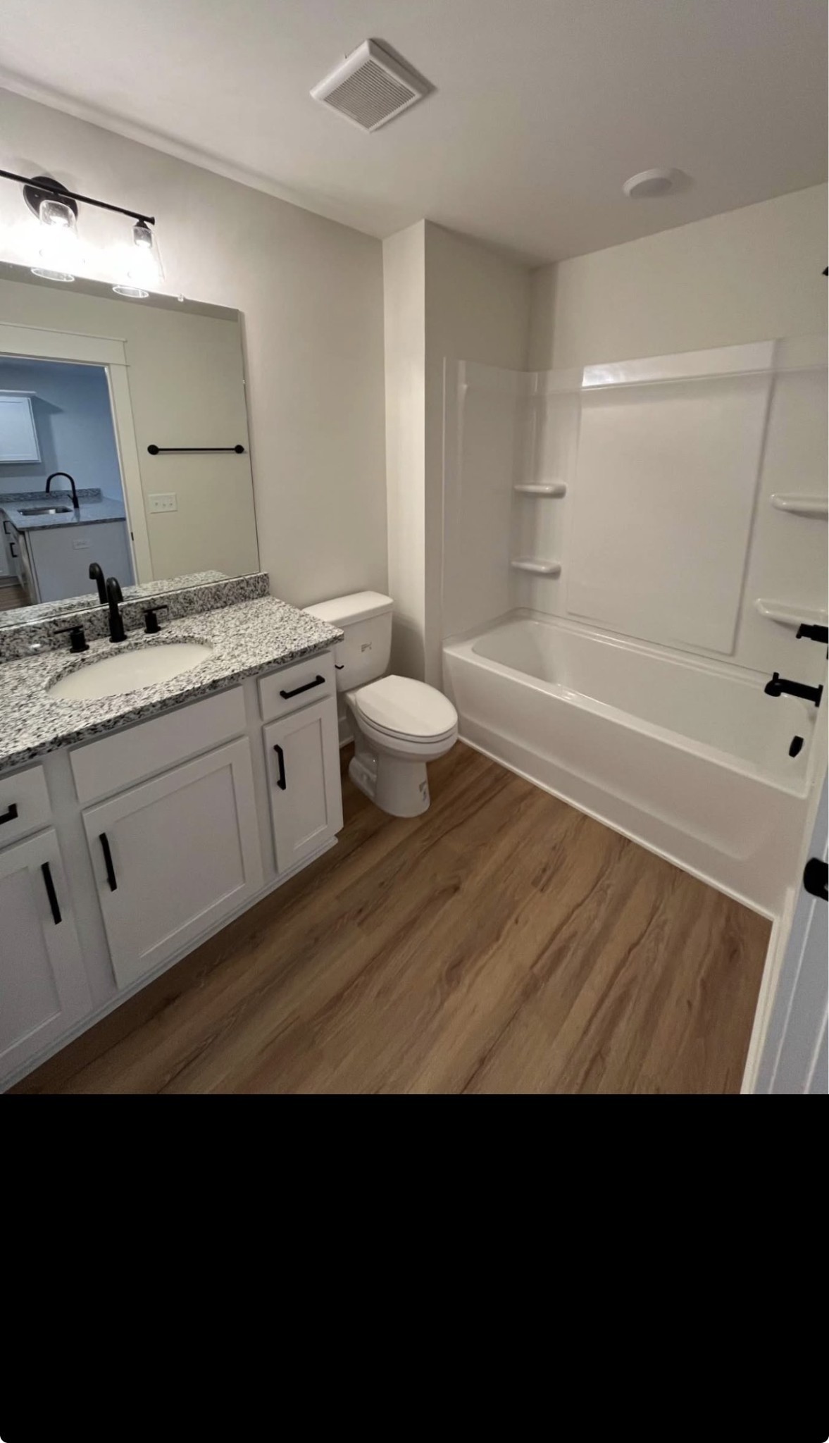 402 Portland Boulevard Portland, TN 37148 - Photo 5 of 16 a bathroom with a sink a toilet and a bathtub