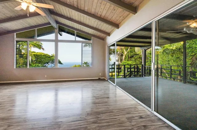 a view of a porch with wooden floor and outdoor space