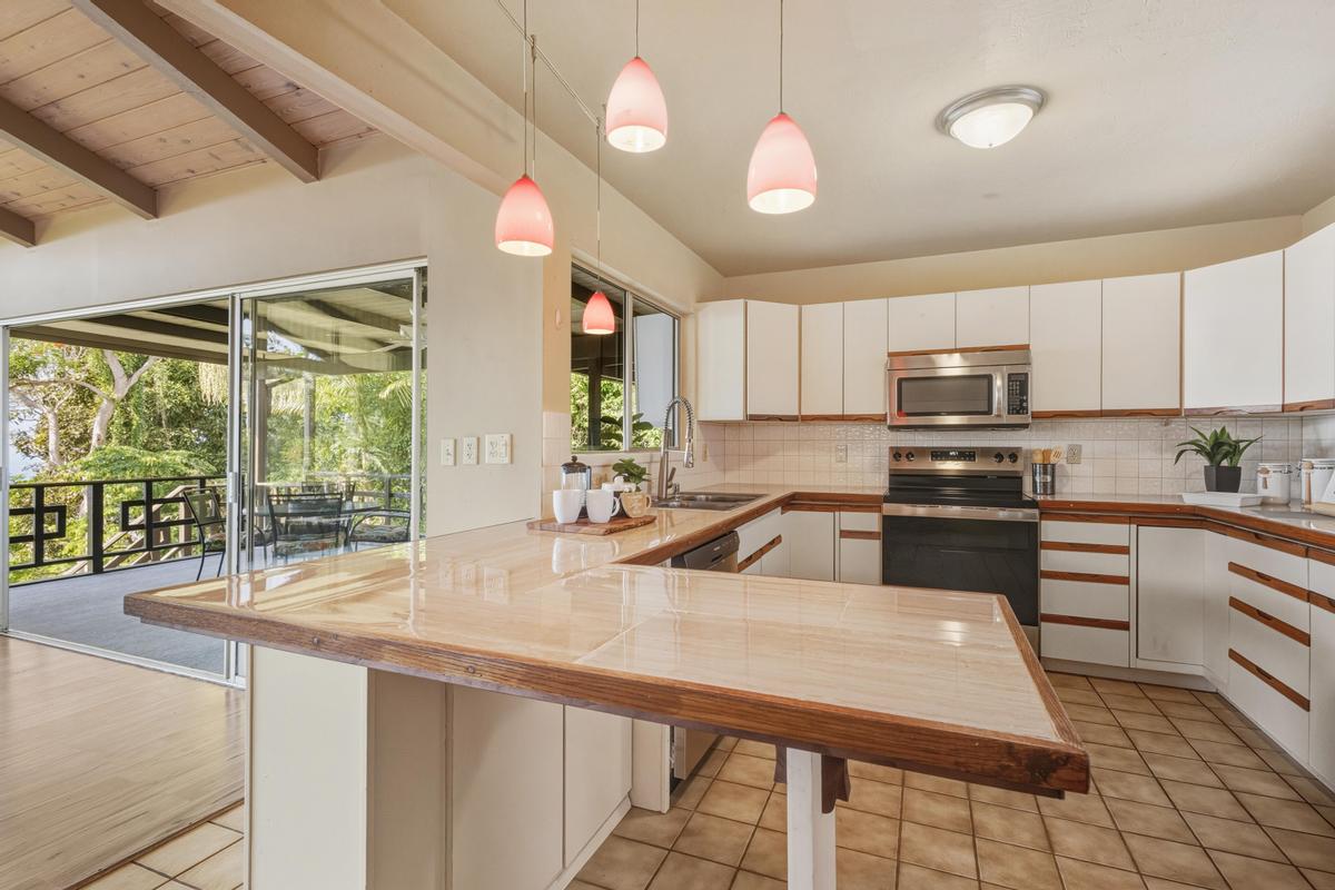 77-6484 Ono Road Kailua-Kona, HI 96740 - Photo 19 of 29 a kitchen with counter top space a sink and appliances