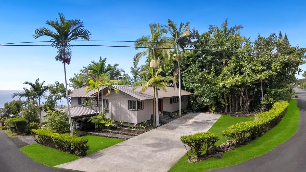 77-6484 Ono Road Kailua-Kona, HI 96740 - Photo 2 of 29 a front view of a house with a yard and potted plants