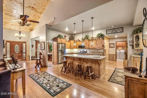 a living room with furniture windows and a flat screen tv