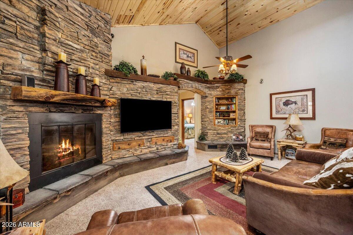2952 Country View Lane Overgaard, AZ 85933 - Photo 17 of 81 a living room with furniture a flat screen tv and a fireplace