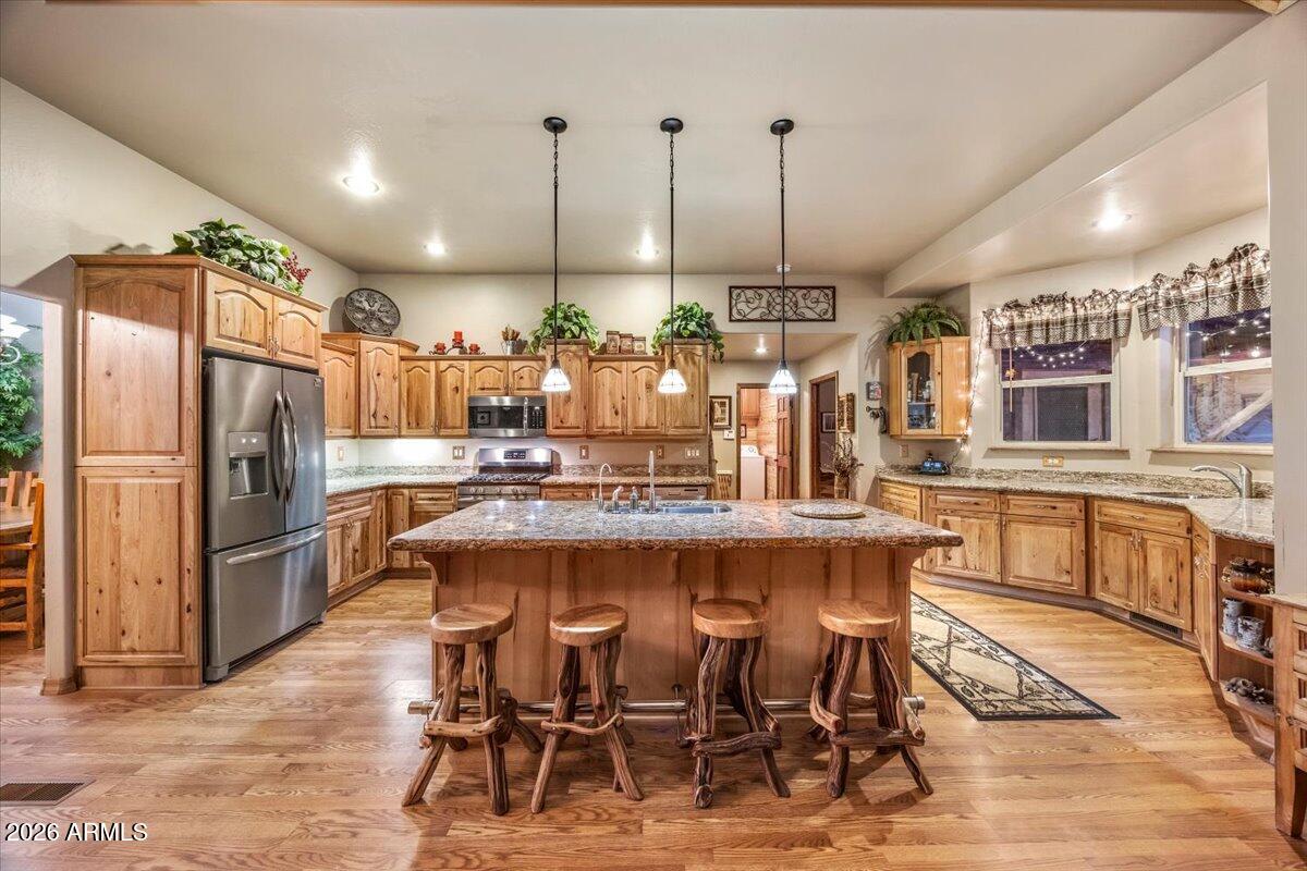2952 Country View Lane Overgaard, AZ 85933 - Photo 19 of 81 a large kitchen with a table and chairs