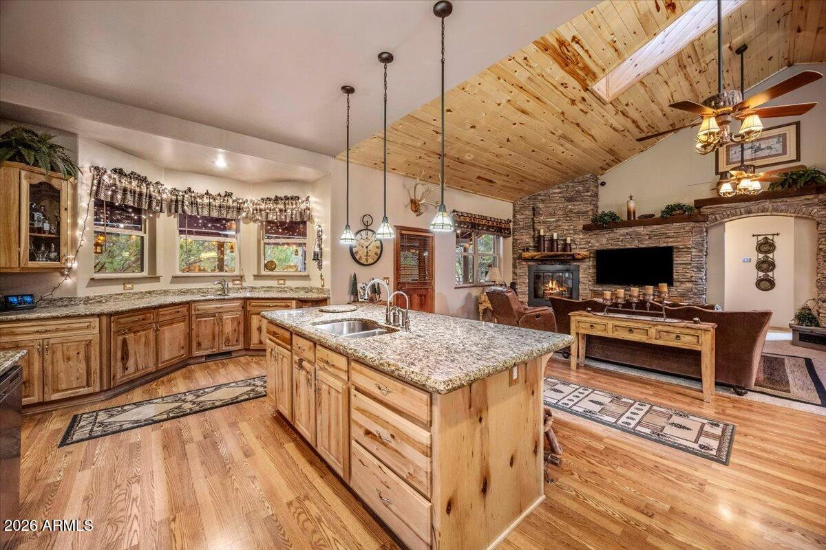2952 Country View Lane Overgaard, AZ 85933 - Photo 20 of 81 a kitchen with stainless steel appliances granite countertop a stove and a wooden floors