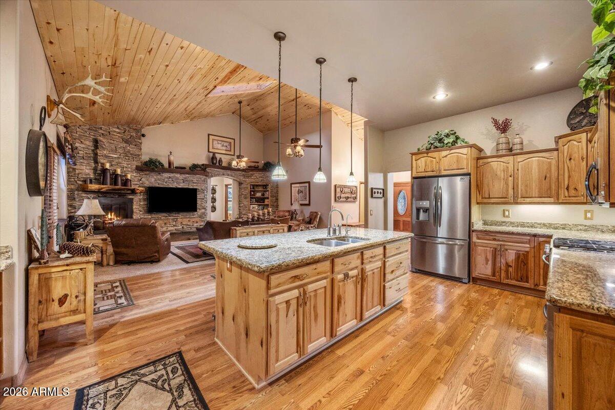 2952 Country View Lane Overgaard, AZ 85933 - Photo 21 of 81 a kitchen with stainless steel appliances granite countertop a stove and a sink
