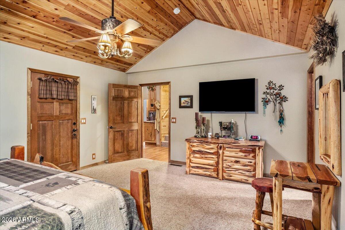 2952 Country View Lane Overgaard, AZ 85933 - Photo 26 of 81 a bedroom with a bed and a flat screen tv