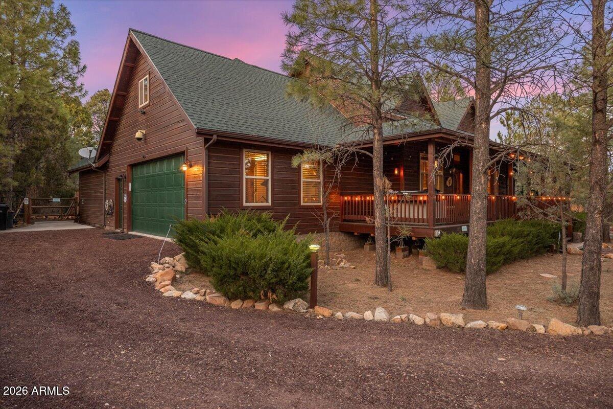 2952 Country View Lane Overgaard, AZ 85933 - Photo 2 of 81 a front view of a house with garden