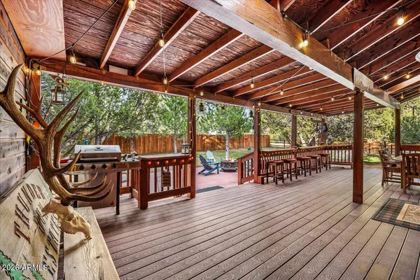 a view of a backyard with a patio and outdoor seating