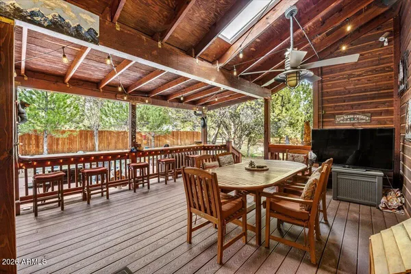 a view of a patio with a table and chairs