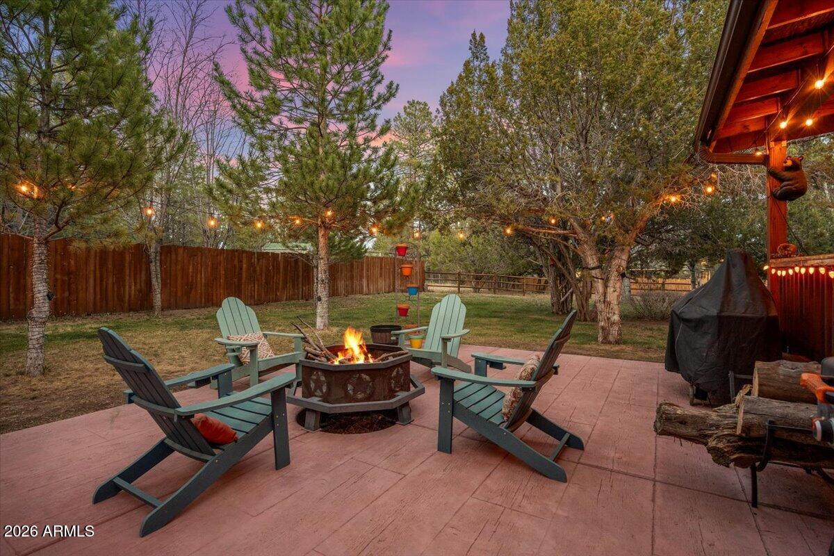 2952 Country View Lane Overgaard, AZ 85933 - Photo 46 of 81 a backyard of a house with table and chairs
