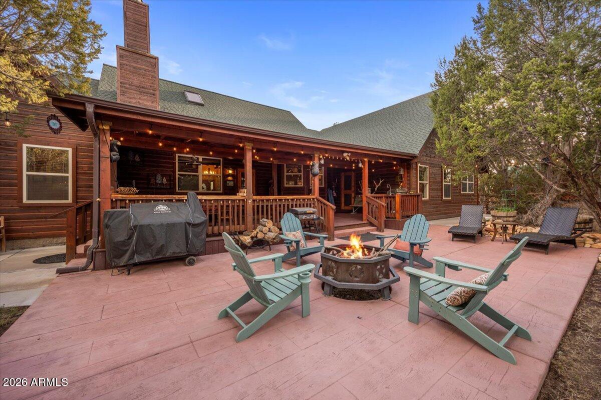 2952 Country View Lane Overgaard, AZ 85933 - Photo 54 of 81 a view of a backyard with a patio and outdoor seating