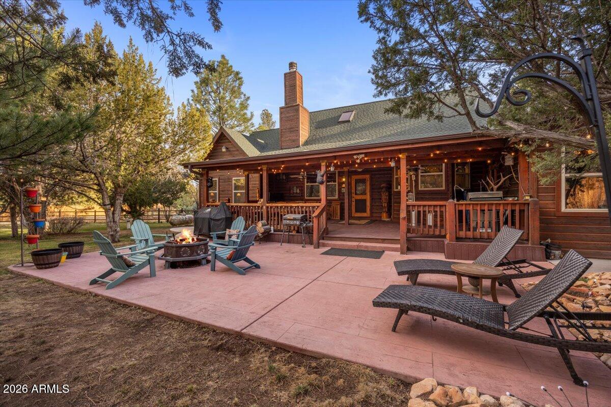 2952 Country View Lane Overgaard, AZ 85933 - Photo 55 of 81 a view of a patio with a table and chairs