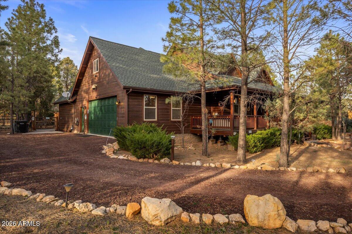 2952 Country View Lane Overgaard, AZ 85933 - Photo 4 of 81 a front view of a house with a yard