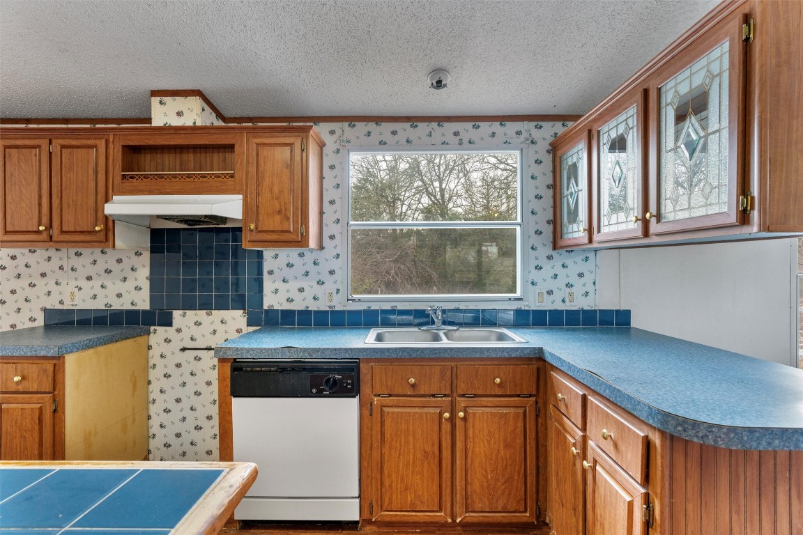 1100 County Road 474 Elgin, TX 78621 - Photo 17 of 40 a kitchen with stainless steel appliances granite countertop a sink stove and cabinets