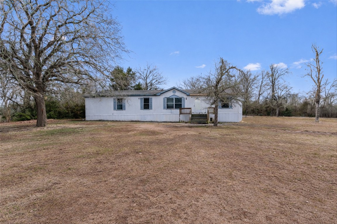1100 County Road 474 Elgin, TX 78621 - Photo 2 of 40 a view of a house with a snow in the yard