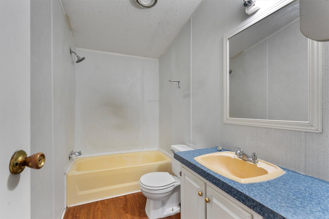 1100 County Road 474 Elgin, TX 78621 - Photo 30 of 40 a bathroom with a sink a toilet and a bathtub