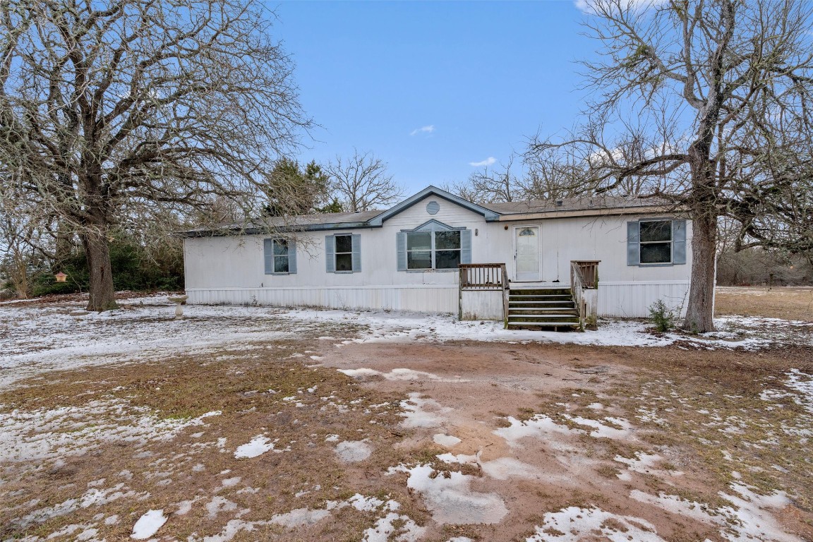 1100 County Road 474 Elgin, TX 78621 - Photo 3 of 40 a view of a house with a yard and large tree