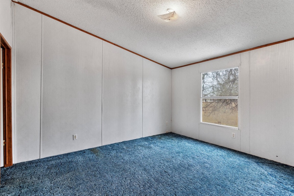 1100 County Road 474 Elgin, TX 78621 - Photo 31 of 40 a view of an empty room with window and closet area
