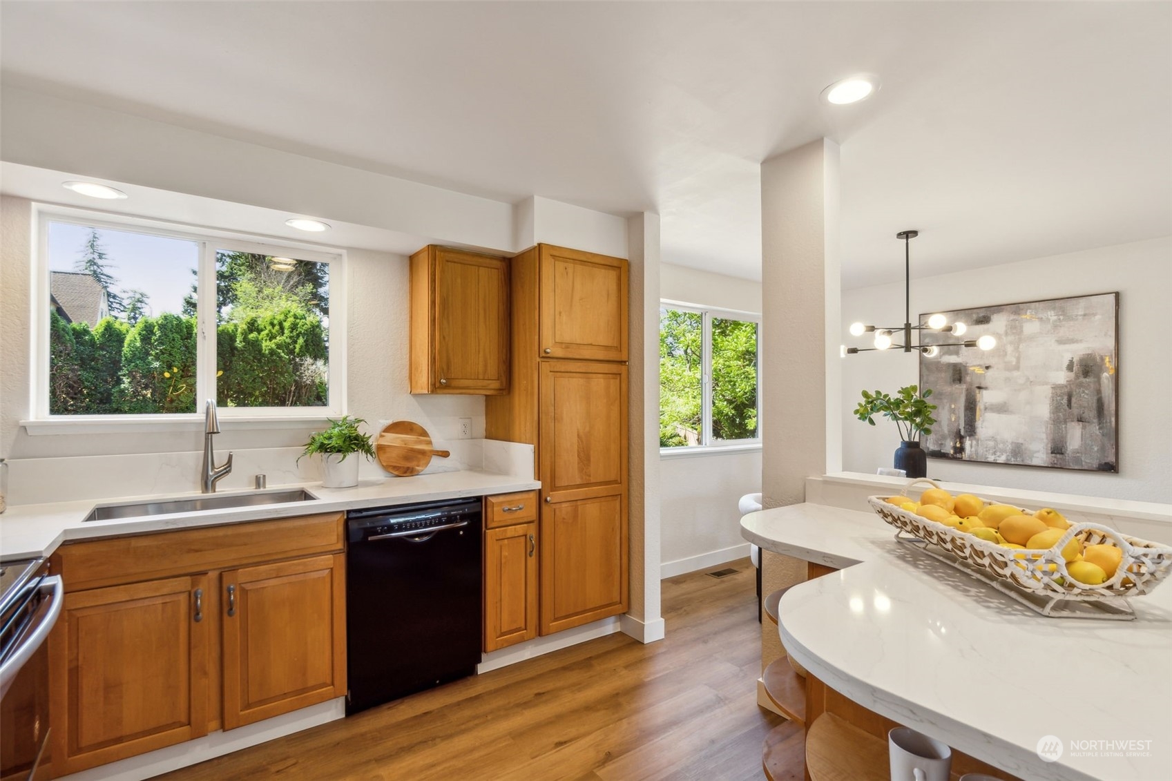 1901 Northeast 17th Place Renton, WA 98056 - Photo 11 of 40 a kitchen with a sink a window and chairs