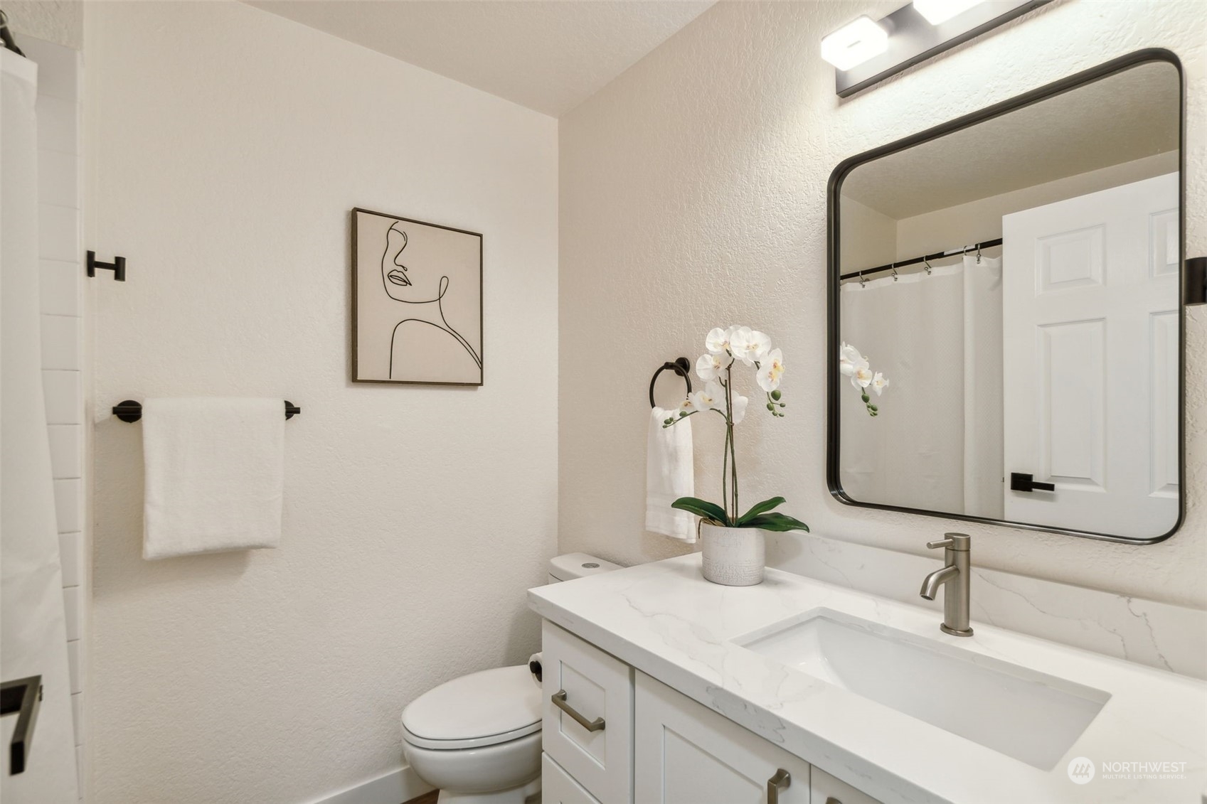 1901 Northeast 17th Place Renton, WA 98056 - Photo 14 of 40 a bathroom with a sink vanity mirror and toilet