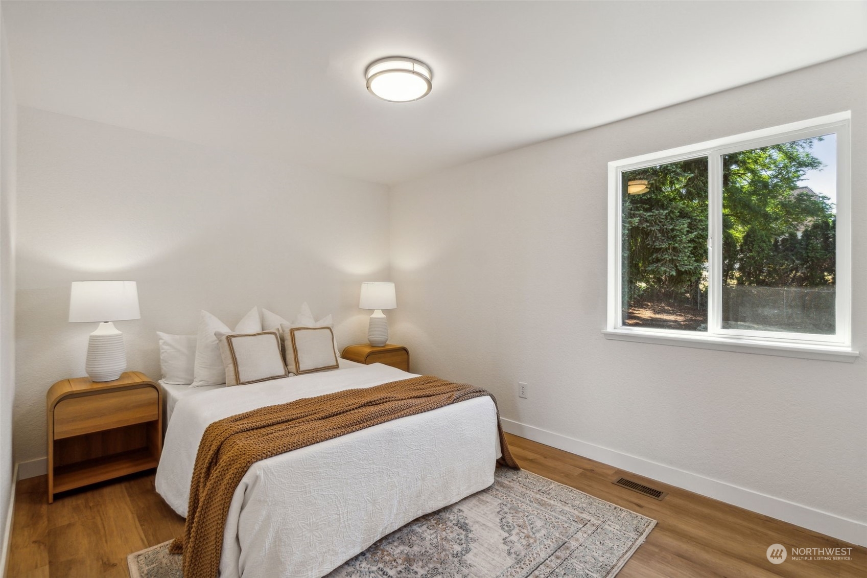 1901 Northeast 17th Place Renton, WA 98056 - Photo 16 of 40 a bedroom with a bed and a window