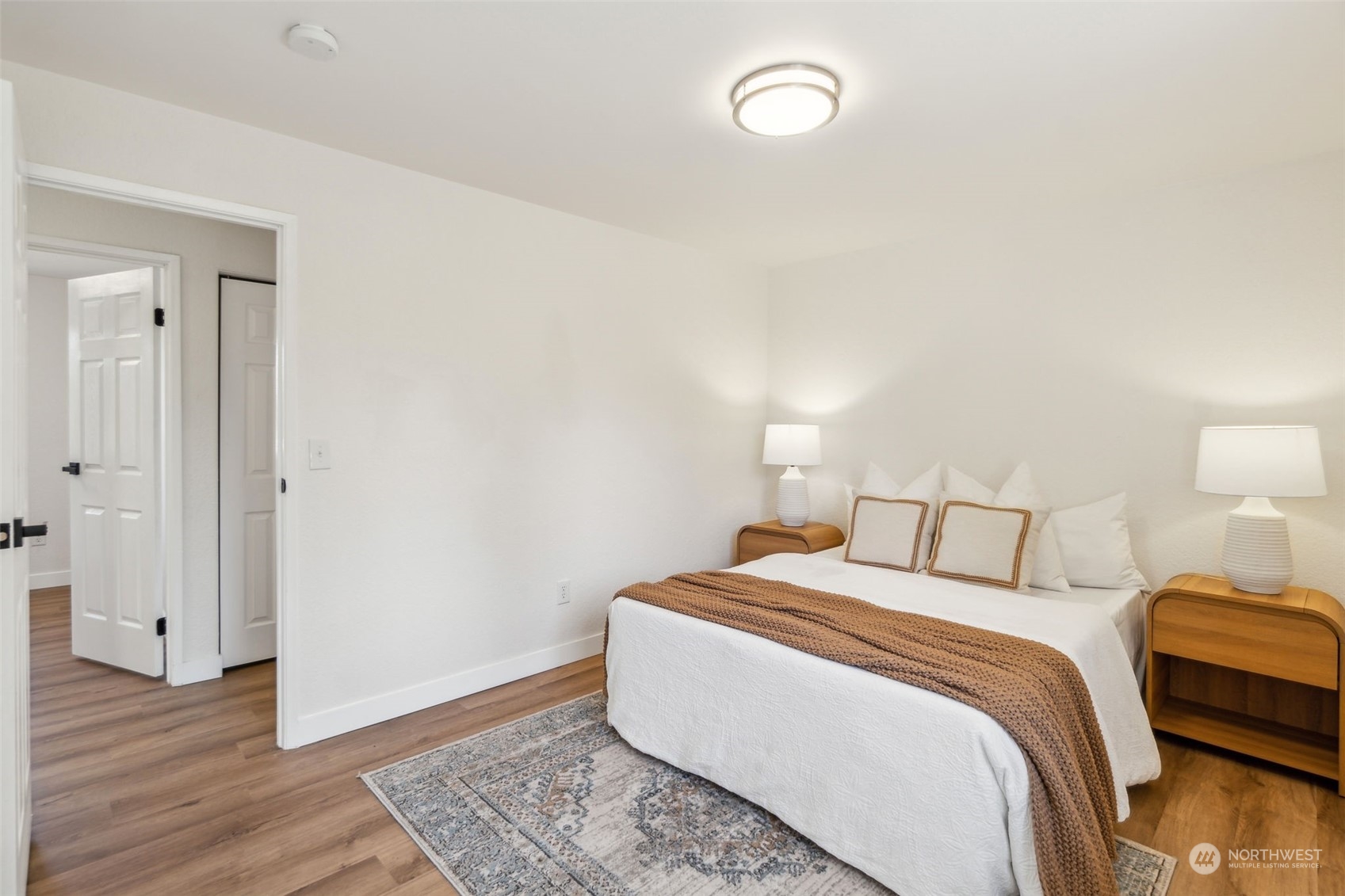 1901 Northeast 17th Place Renton, WA 98056 - Photo 17 of 40 a bedroom with a bed and wooden floor