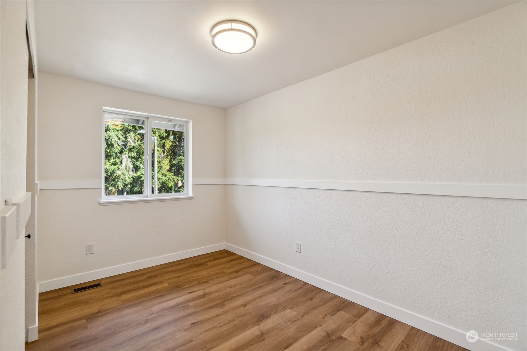 1901 Northeast 17th Place Renton, WA 98056 - Photo 20 of 40 an empty room with wooden floor and window
