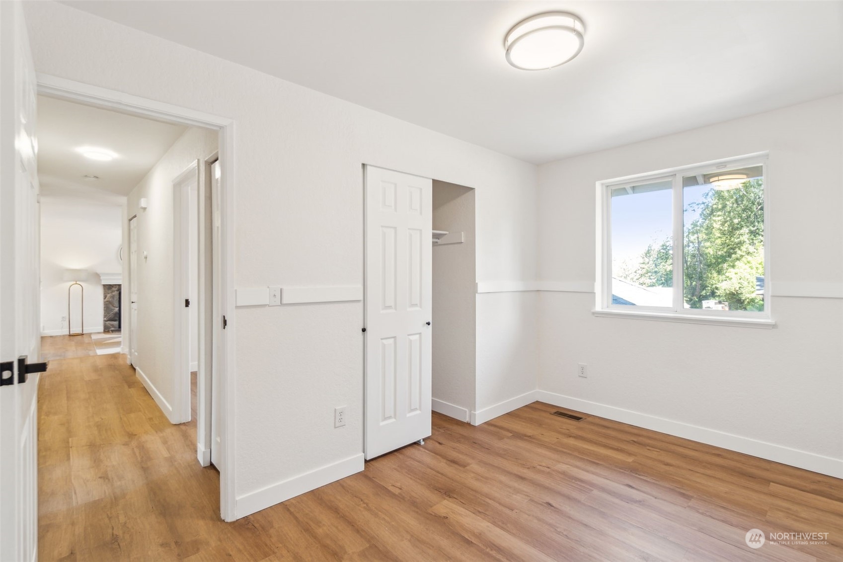 1901 Northeast 17th Place Renton, WA 98056 - Photo 21 of 40 an empty room with wooden floor and windows